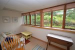 Seating area with plenty of light in lower level queen bedroom